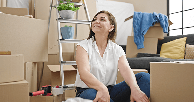 Woman unpacking in new apartment